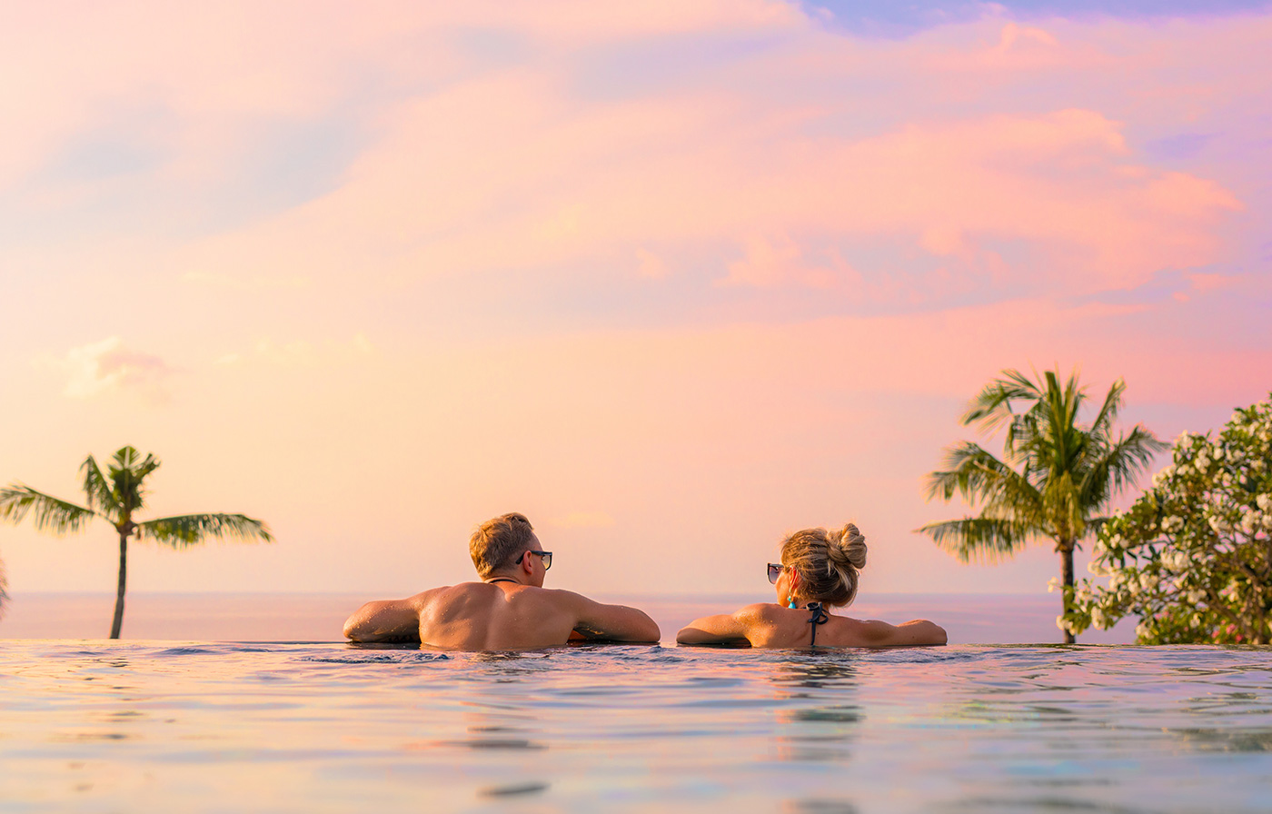couple sunset pool