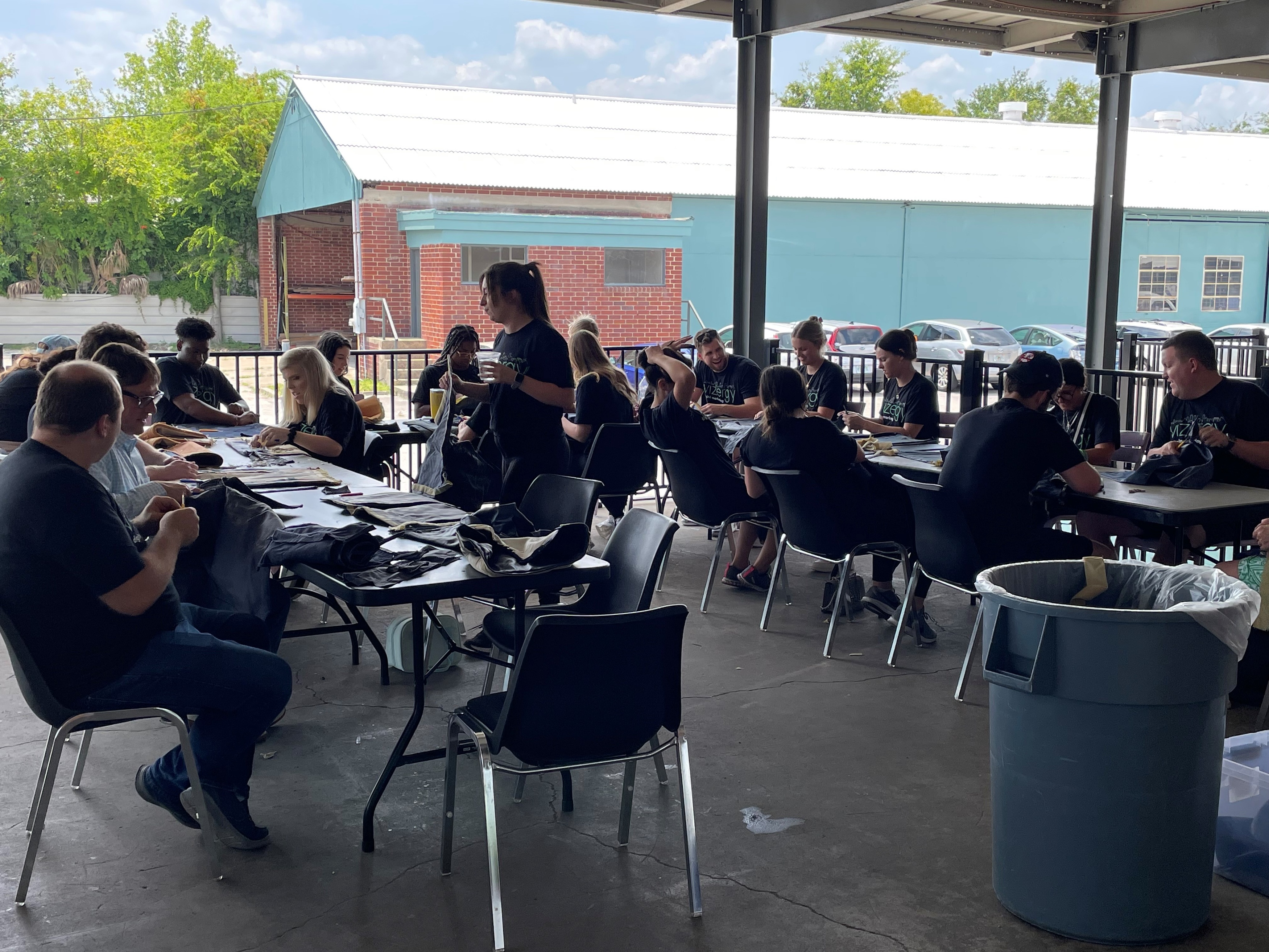 employees sitting and working with fabric